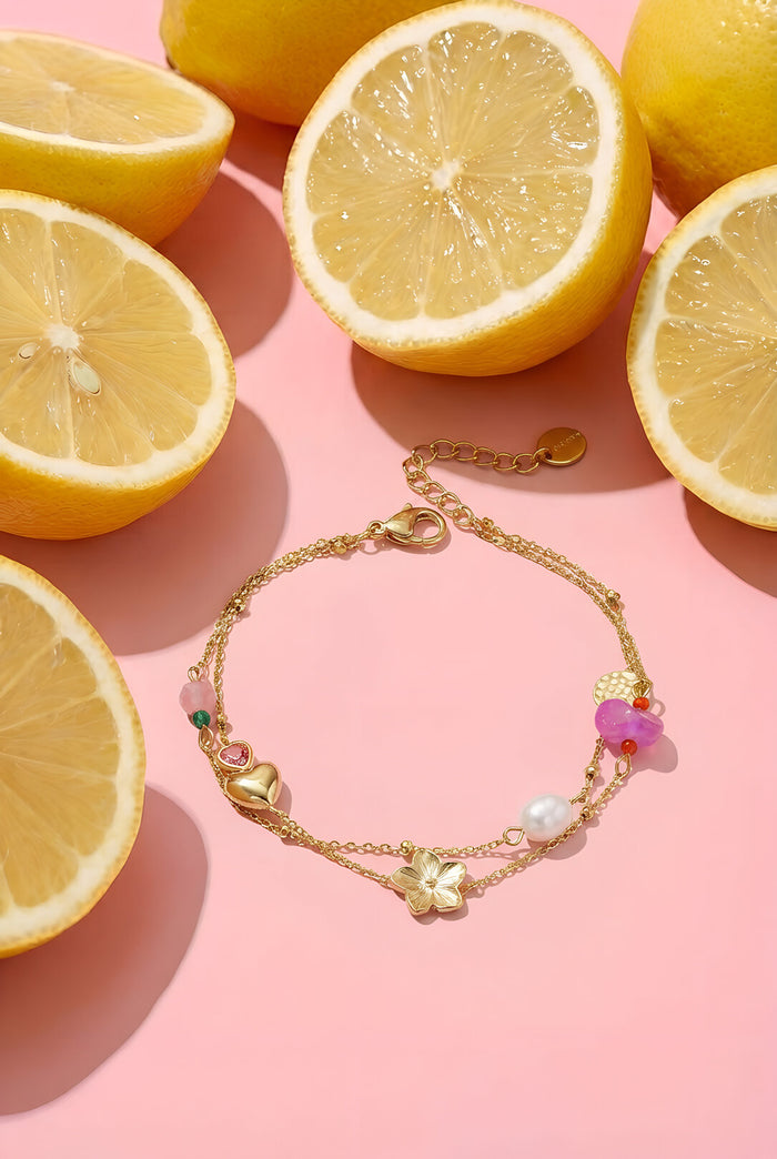 Bedelarmband met hart, bloem, parel en kraaltjes