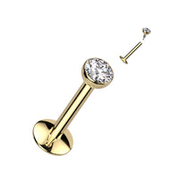 Goudkleurige titanium labret piercing met zirconia top