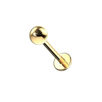 Goudkleurige labret piercing van chirurgisch staal – tijdloos en stijlvol ontwerp.