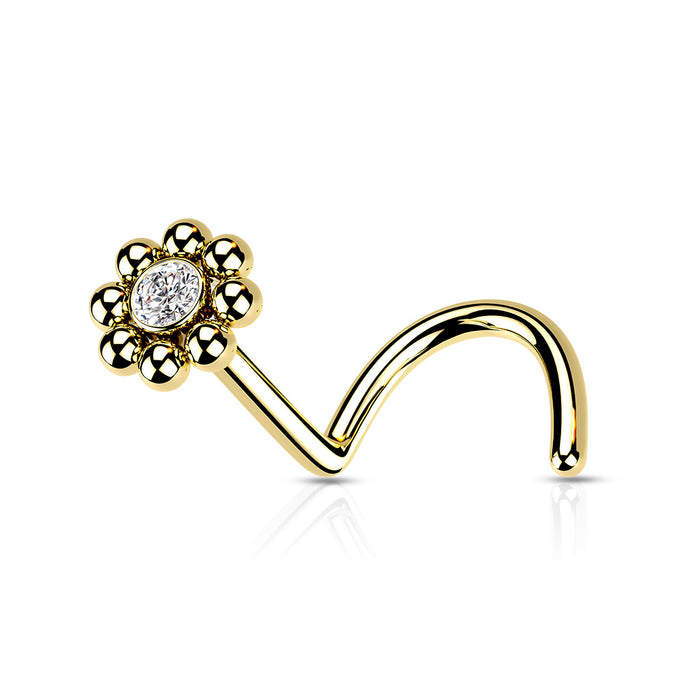 Goudkleurige neuspiercing met kristal in het midden en rondom bolletjes, glanzend en elegant