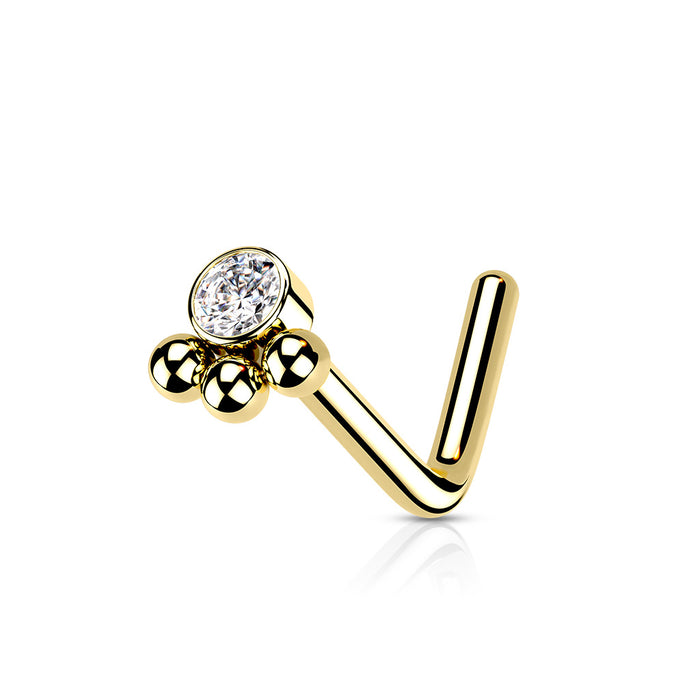 Goudkleurige neuspiercing met een zirconia steen en drie bolletjes – chirurgisch staal